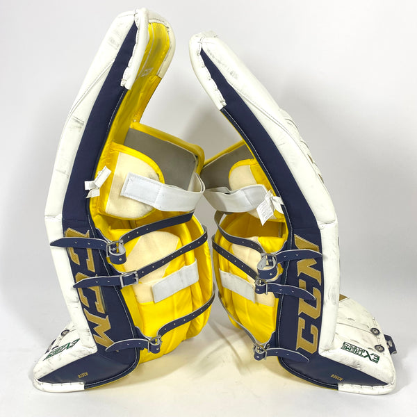 CCM Extreme Flex 4 - Used NCAA Pro Stock Senior Goalie Pads (White/Gold)