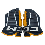CCM HG97XP - Gant NCAA Pro Stock d'occasion (bleu marine/jaune)